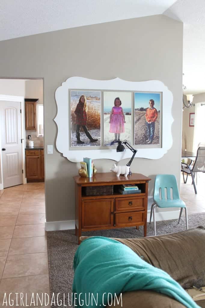 giant wall decorating with pictures and cut it out frames