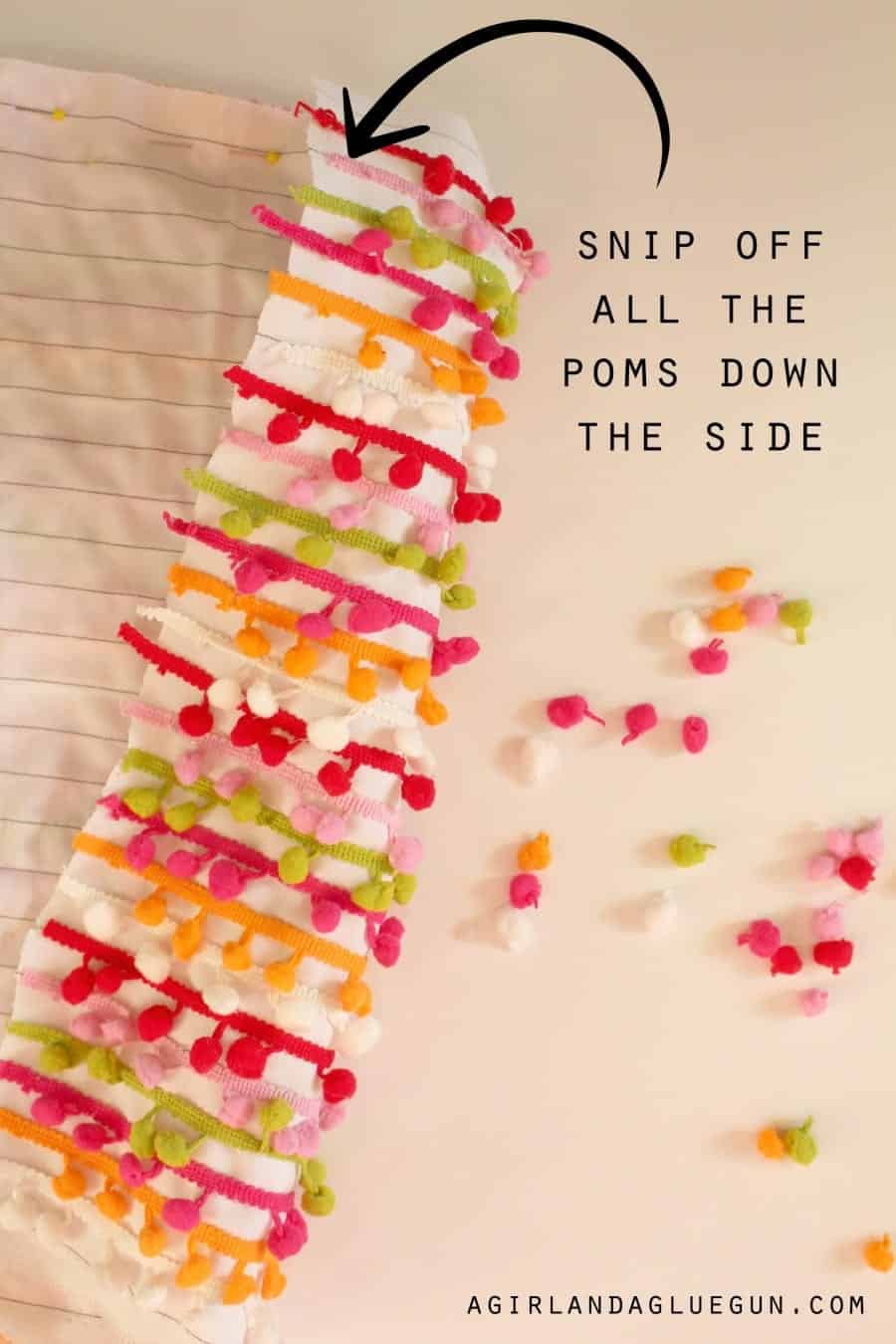 snip off all the poms down the side