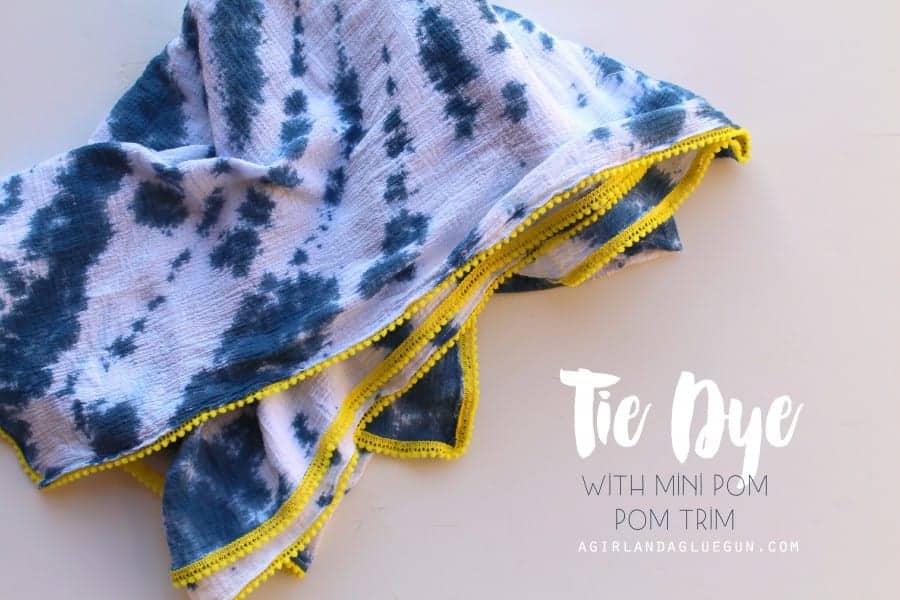 tie dye blanket with mini pom pom trim