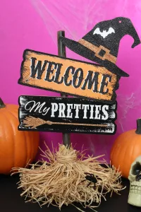 cute witch broom sign for halloween