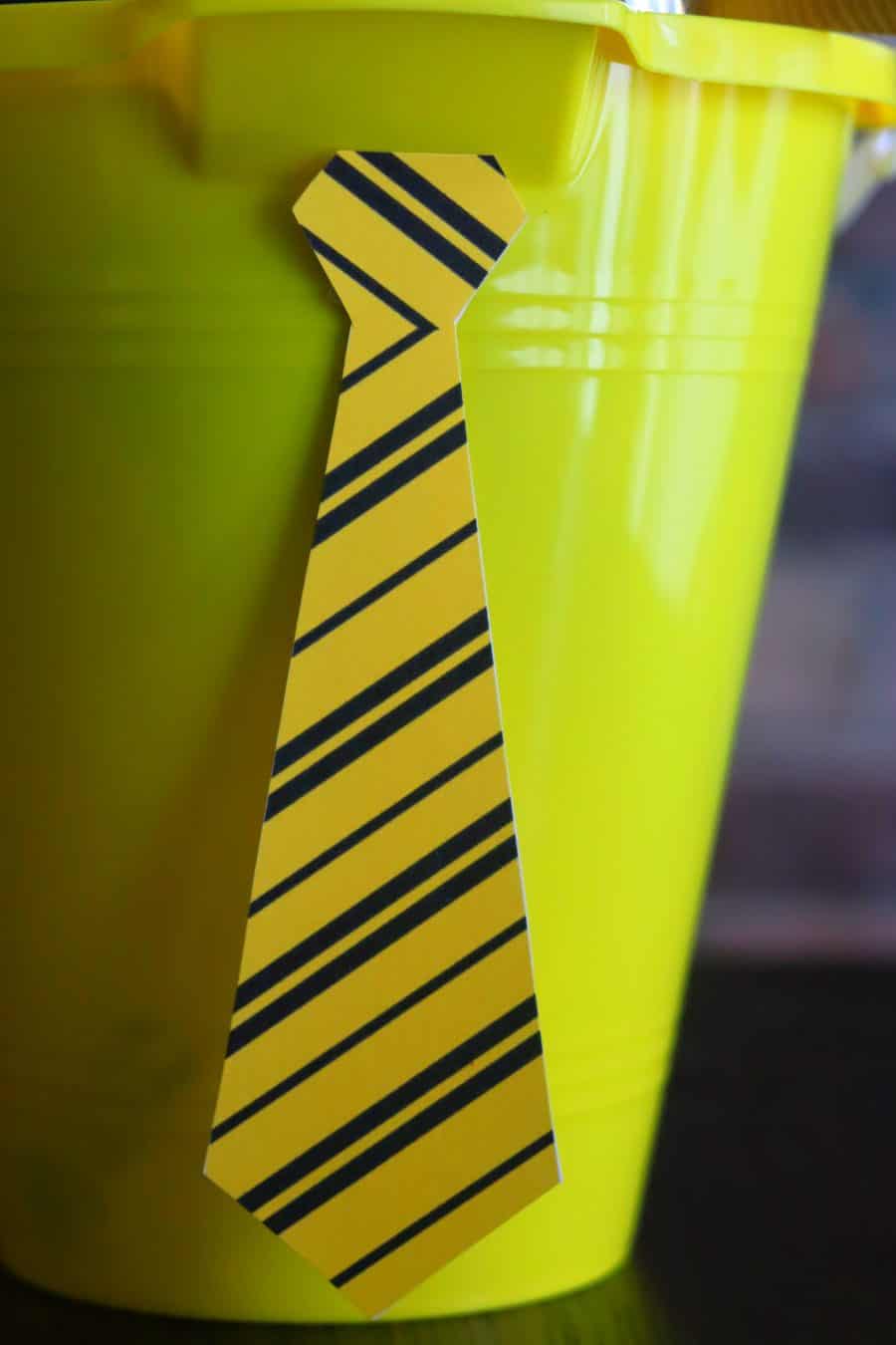 yellow and black striped tie attached to a bucket