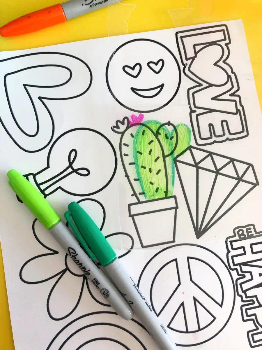 sheet of miscellaneous graphics and shapes, with a cactus colored in marker